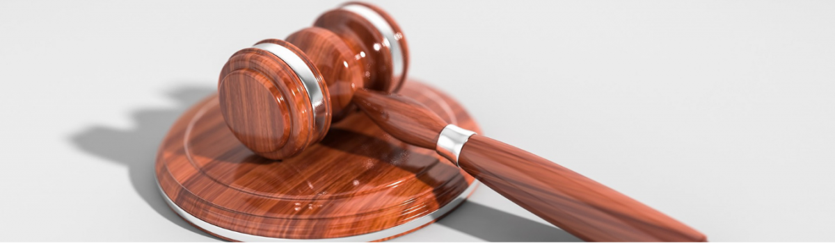wooden gavel laying on table